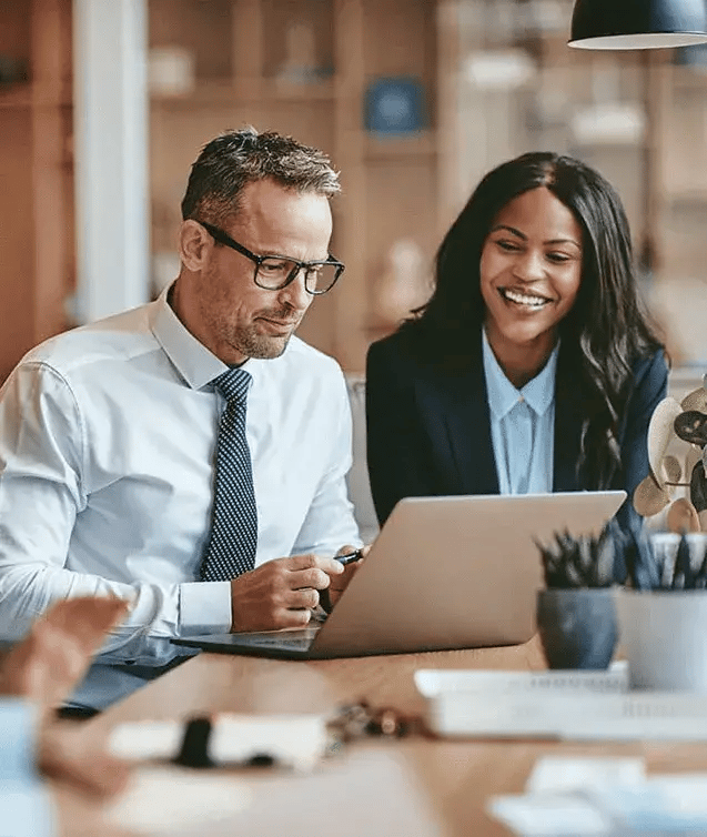 male-and-female-business-colleages-working-together-from-laptop